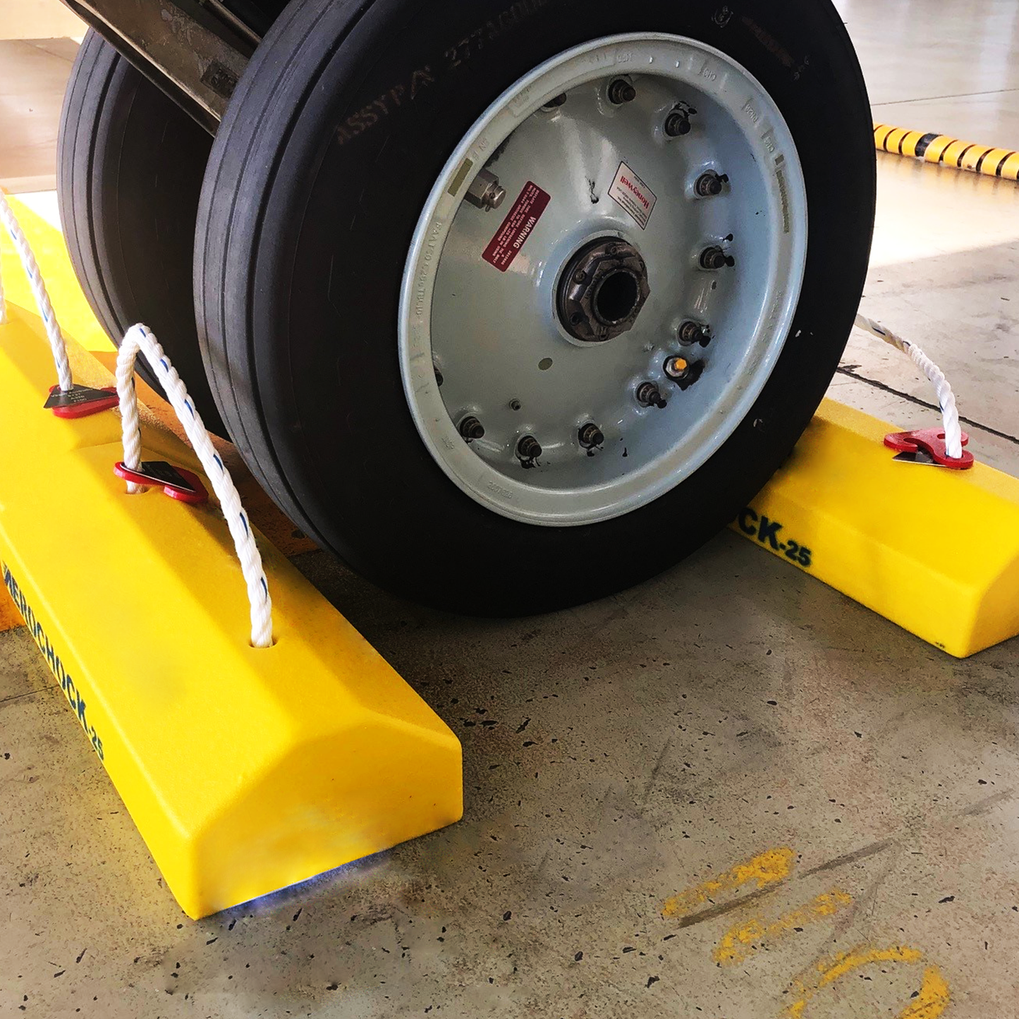 NPR08203-00-(Aerochock25-B) in use on plane wheel